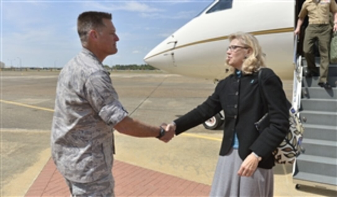 Acting Deputy Defense Secretary Christine H. Fox shakes hands with Air Force Maj. Gen. Brian T. Bishop as she arrives during a visit with students and faculty of the Air War College on Maxwell Air Force Base in Montgomery, Ala., April 3, 2014. Bishop is the college's commandant and commander of the Carl A. Spaatz Center for Officer Education.