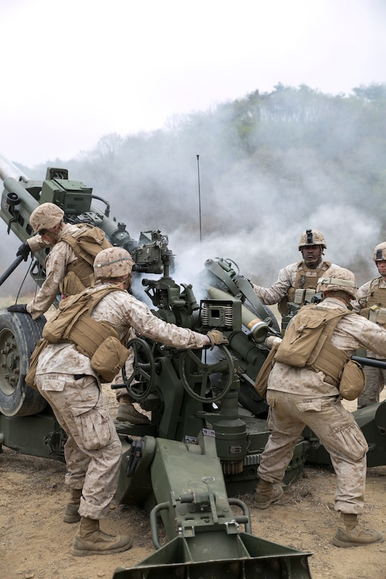 Artillery Marines fire off rounds from M777A2 lightweight 155 mm howitzers April 3 at Su Seung-ri Range in the Republic of Korea as part of Exercise Ssang Yong 2014. The Marines shot off eight rounds during the calibration portion of the live-fire, followed by another 40 rounds in succession. Ssang Yong is an exercise that showcases the amphibious and expeditionary capabilities of the ROK and U.S. forces as well as the maturity of the relationship between the two nations. The Marines are with Golf Battery, 2nd Battalion, 11th Marine Regiment currently assigned to Battalion Landing Team 2nd Bn., 5th Marines, 31st Marine Expeditionary Unit, III Marine Expeditionary Force. (U.S. Marine Corps photo by Cpl. Lena Wakayama/Released)
