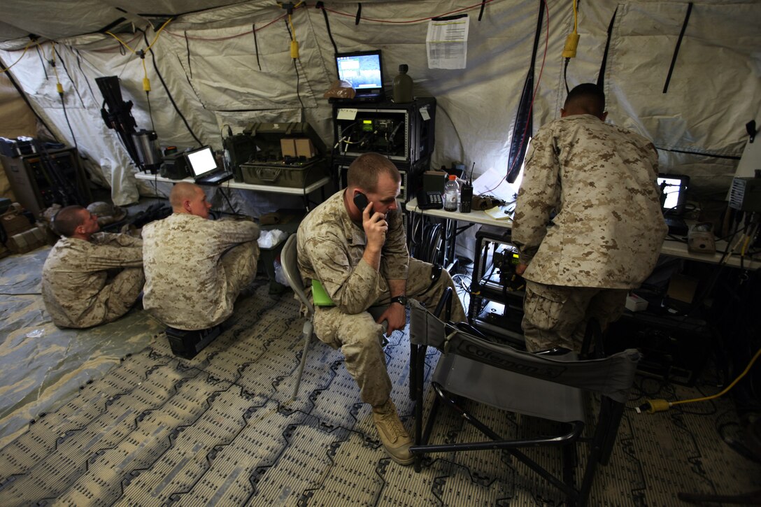 Marines of the 31st Marine Expeditionary Unit’s Command Element monitor radio traffic in the command operations center for Regimental Landing Team 31, 3d Marine Expeditionary Brigade, as part of Exercise Ssang Yong 2014 here, April 2. For the duration of the exercise, the 31st MEU’s CE became RLT-31, which is the ground combat element of 3d MEB for the bilateral training exercise with Republic of South Korea forces. RLT-31 consists of Battalion Landing Teams 2nd Battalion, 5th Marines; 1st Battalion, 4th Marines; 2nd Battalion, 3rd Marines; as well as elements of 1st Tank Battalion, 4th Tank Battalion, 3rd Law Enforcement Battalion and 3rd Light Armored Reconnaissance Battalion. Ssang Yong shows the interoperability of the Republic of Korea (ROK) and US forces, and demonstrates their ability to conduct amphibious operations and exercise expeditionary capabilities. 