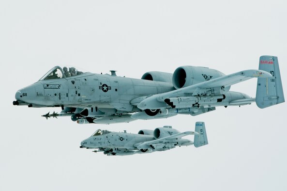 First Lt. Micha Stoddard, flying the lead aircraft, and his wingman Capt. Casey Peasley fly their A-10 Thunderbolt IIs in an echelon formation March 26, 2014, enroute from Barksdale Air Force Base, La., to their home base in Boise, Idaho. The crews performed an in-air refueling with a Utah National Guard KC-135 Stratotanker after the air combat exercise Green Flag East. Stoddard and Peasley are with the 190th Fighter Squadron. (U.S. Air National Guard photo/Master Sgt. Becky Vanshur)