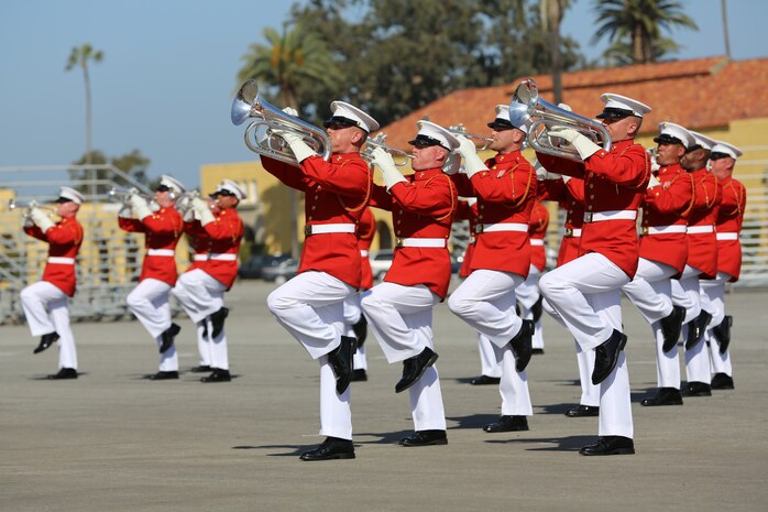 The U.S. Marine Drum & Bugle Corps strides in their performance during the Battle Color Ceremony on Shepherd’s Field aboard the depot, March 15. Known as “The Commandant’s Own,” the musicians played contemporary songs and traditional marching music with choreographed drill movements as part of their “Music in Motion” program.
