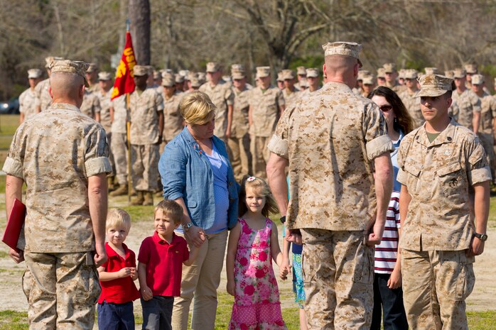 Staff Sgt. Brandon R. Trent (right), a Lawrence, Kan., native and explosive ordnance disposal technician with 2nd EOD Company, 8th Engineer Support Battalion, 2nd Marine Logistics Group, stands at the position of attention in front of Brigadier General Edward D. Banta, the commanding general of 2nd MLG, during a Bronze Star Medal award ceremony aboard Camp Lejeune, N.C., April 4, 2014. Trent earned the medal with combat distinguishing device for his actions disarming improvised explosive devices while deployed in support of Operation Enduring Freedom in 2013. In a period of less than 24 hours, Trent rendered nine improvised explosive devices safe during a clearing operation in Helmand province, Afghanistan. Trent worked into the night, uncovering and disarming additional IEDs along the way. He manually approached and disarmed two of the IEDs after exhausting remote deactivation methods. (U.S. Marine Corps photo by Cpl. Shawn Valosin)