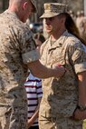 Brigadier General Edward D. Banta (left), the commanding general of the 2nd Marine Logistics Group, awards Staff Sgt. Brandon R. Trent (right), a Lawrence, Kan., native and explosive ordnance disposal technician with 2nd EOD Company, 8th Engineer Support Battalion, 2nd MLG, the Bronze Star Medal with combat distinguishing device during an award ceremony aboard Camp Lejeune, N.C., April 4, 2014. Trent earned the medal with combat distinguishing device for his actions disarming improvised explosive devices while deployed in support of Operation Enduring Freedom in 2013. In a period of less than 24 hours, Trent rendered nine improvised explosive devices safe during a clearing operation in Helmand province, Afghanistan. Trent worked into the night, uncovering and disarming additional IEDs along the way. He manually approached and disarmed two of the IEDs after exhausting remote deactivation methods.