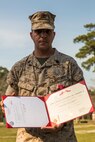 Staff Sgt. Brandon R. Trent, a Lawrence, Kan., native and explosive ordnance disposal technician with 2nd EOD Company, 8th Engineer Support Battalion, 2nd Marine Logistics Group, poses for a photo after his Bronze Star Medal award ceremony aboard Camp Lejeune, N.C., April 4, 2014. Trent earned the medal with combat distinguishing device for his actions disarming improvised explosive devices while deployed in support of Operation Enduring Freedom in 2013. In a period of less than 24 hours, Trent rendered nine improvised explosive devices safe during a clearing operation in Helmand province, Afghanistan. Trent worked into the night, uncovering and disarming additional IEDs along the way. He manually approached and disarmed two of the IEDs after exhausting remote deactivation methods. (U.S. Marine Corps photo by Cpl. Shawn Valosin)
