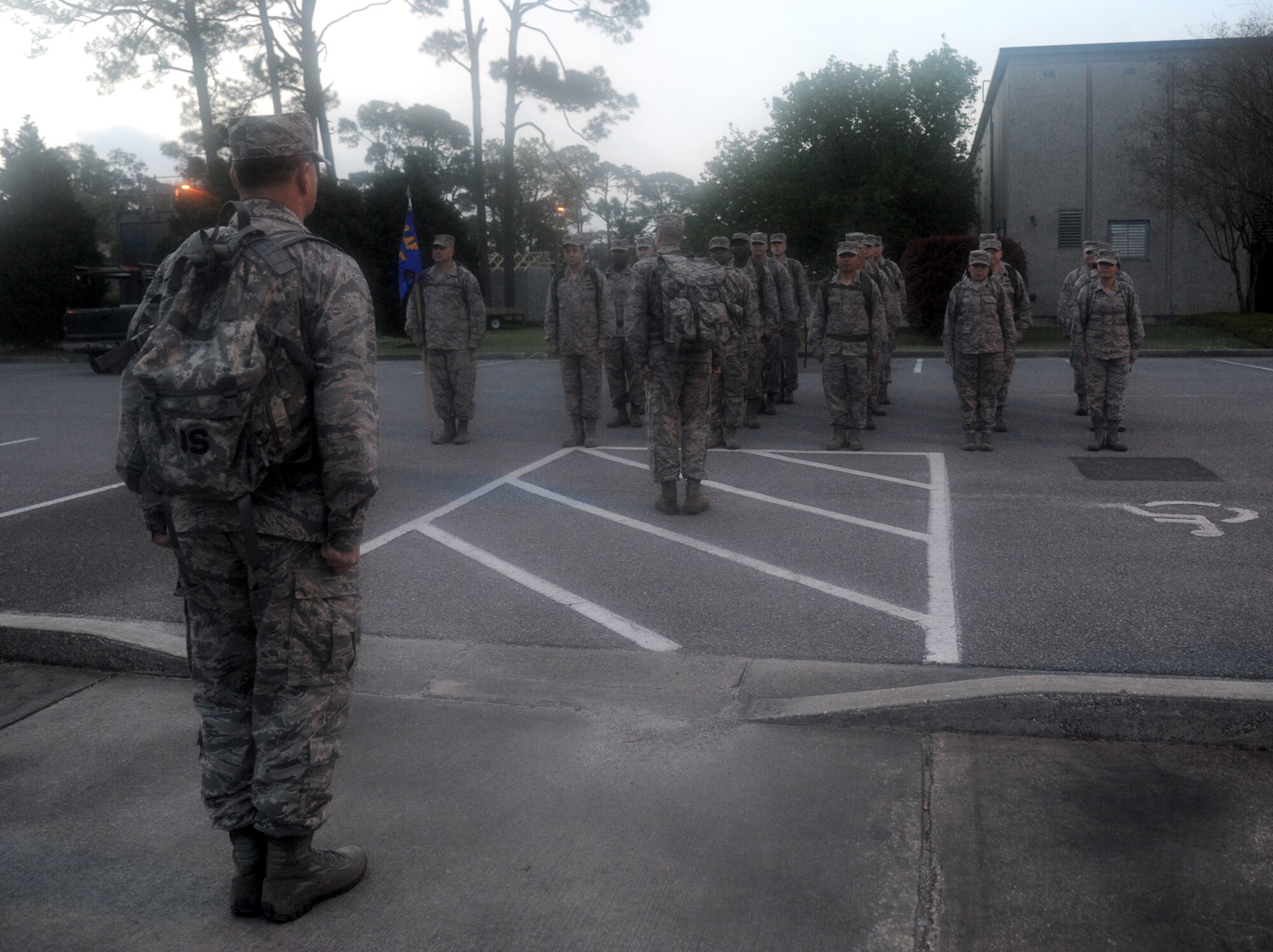 Members of the 602nd Training Group (Provisional) stand in formation in preparation for an 84-mile ruck march April 2, 2014, at Keesler Air Force Base, Miss. The three day march which starts here and ends at Camp Shelby Army Post, Miss., is meant to commemorate the 602nd TRG (P) mission in support of joint expeditionary tasking’s and to remember the students who made the ultimate sacrifice. (U.S. Air Force photo/Kemberly Groue) 