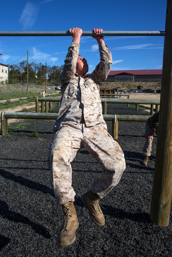 Cpl. Russell Atkinson, an AH-1G Huey Cobra mechanic with Marine Light Attack Helicopter Squadron 169, navigates the obstacle course during a Committed and Engaged Leadership Indoctrination course aboard Marine Corps Base Camp Pendleton, Calif., April 1-3. Maj. Gen. Steven Busby, 3rd Marine Aircraft Wing commanding general, implemented the course held in the field to teach new noncommissioned officers about the responsibilities that come with the promotion. Busby hopes to empower the new NCOs to better the Marine Corps as part of the Committed and Engaged Leadership initiative.
