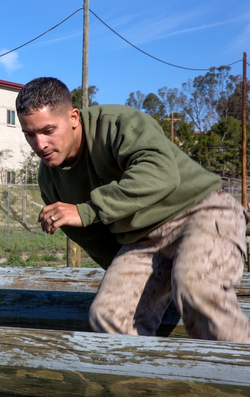 Cpl. Johan Cotto, an MV-22B aviation technician with Marine Medium Tiltrotor Squadron 165, navigates the obstacle course during a Committed and Engaged Leadership Indoctrination course aboard Marine Corps Base Camp Pendleton, Calif., April 1-3. Maj. Gen. Steven Busby, 3rd Marine Aircraft Wing commanding general, implemented the course held in the field to teach new noncommissioned officers about the responsibilities that come with the promotion. Busby hopes to empower the new NCOs to better the Marine Corps as part of the Committed and Engaged Leadership initiative.