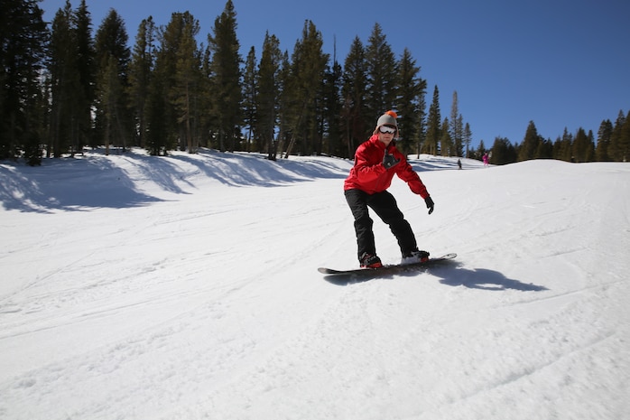 Lance Cpl. Zachary D. Selvig, fiscal clerk, Headquarters and Service Battalion, snowboards down an intermediate hill at Mammoth Mountain. The course offered the Marines beginner, intermediate, advanced and expert slopes.
