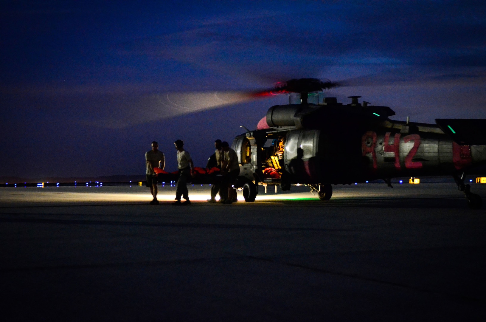 Pararescuemen assigned to the California Air National Guard 129th Rescue Wing transfer a patient from an HH-60G helicopter to land-based medical facilities during a long range over water search and rescue mission which originated 1,400 miles off the Coast of Acapulco, Mexico on Sept. 9, 2012. A similar mission is underway to save an American baby.