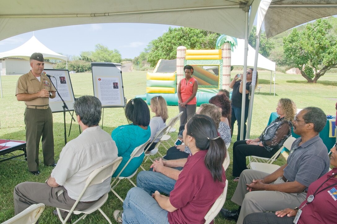 Lt. Col. Robert Maldonado, commanding officer of Headquarters Battalion, offers opening remarks during a fair celebrating
the opening of the new Counseling, Advocacy, Awareness, Relationship Enhancement Center, held March 27, 2014. The CAARE Center, located in building 216, offers free programs and counseling for Marines and their families. (U.S. Marine Corps photo by Christine Cabalo)

