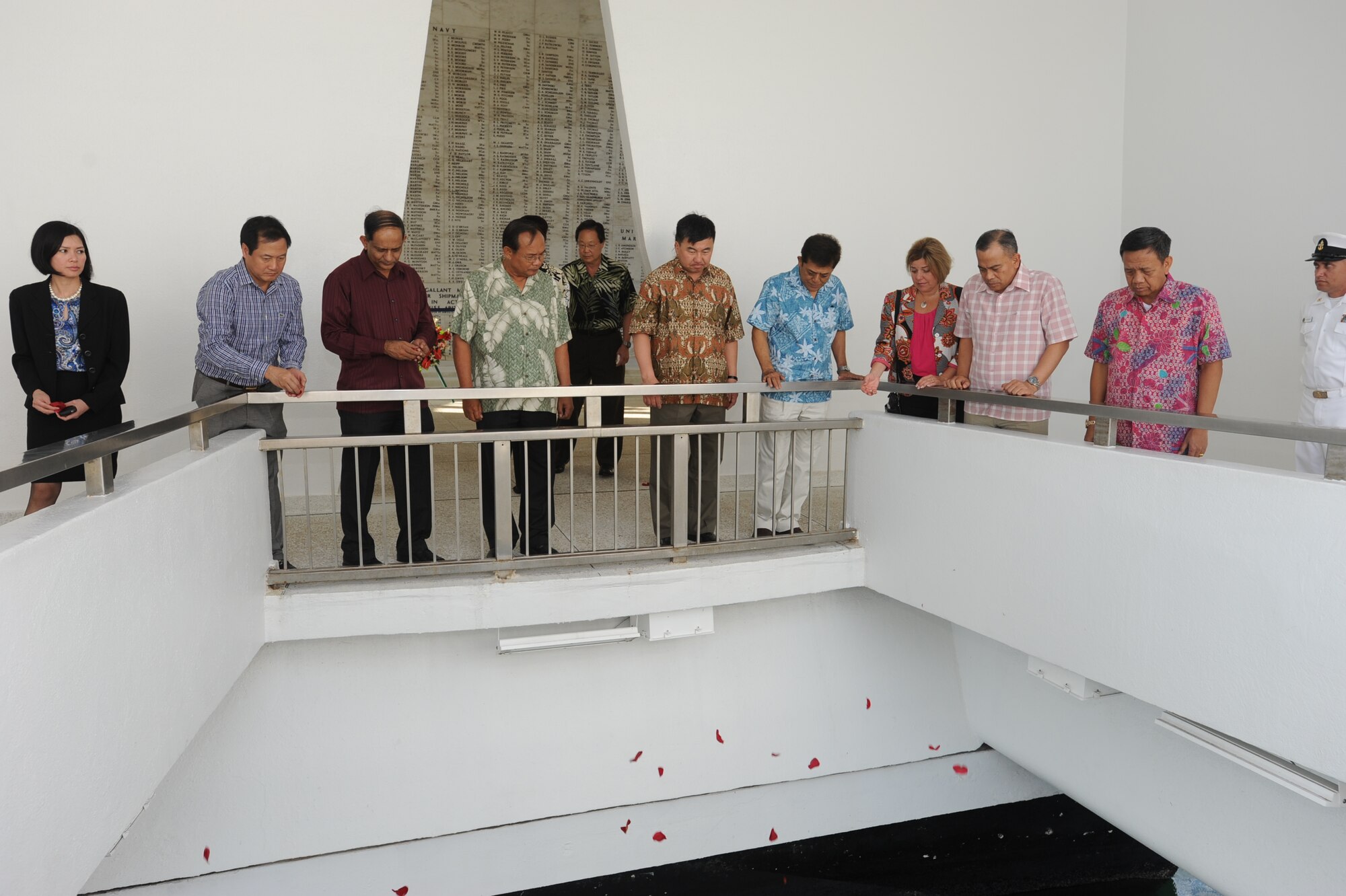 Top Air Force leaders from several Pacific nations pay tribute to those who died aboard the USS Arizona during a wreath laying ceremony at the memorial March 28, 2014. The group is taking part in the Pacific Air Chief’s Symposium at Joint Base Pearl Harbor-Hickam. They are also scheduled to visit three mainland Air Force bases and Washington, D.C. (U.S. Air Force photo by Master Sgt. Victoria Boncz)