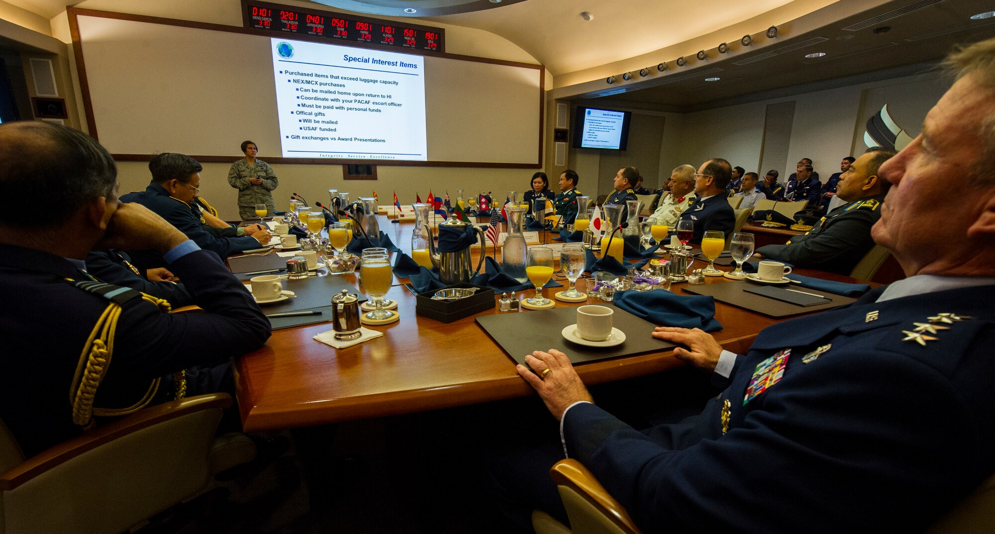 Attendees of the 2014 Pacific Air Chiefs' Symposium receive an introductory briefing at the Pacific Air Forces Headquarters building March 29, 2014, at Joint Base Pearl Harbor-Hickam, Hawaii. Through the discussions held at the symposium, Gen. Hawk Carlisle, Pacific Air Forces commander, said he hopes to exercise the multilateral approach required to address common security concerns to ensure stability, while similarly recognizing the value each country brings with its capabilities to create synergy among militaries. (U.S. Air Force photo by Staff Sgt. Nathan Allen)