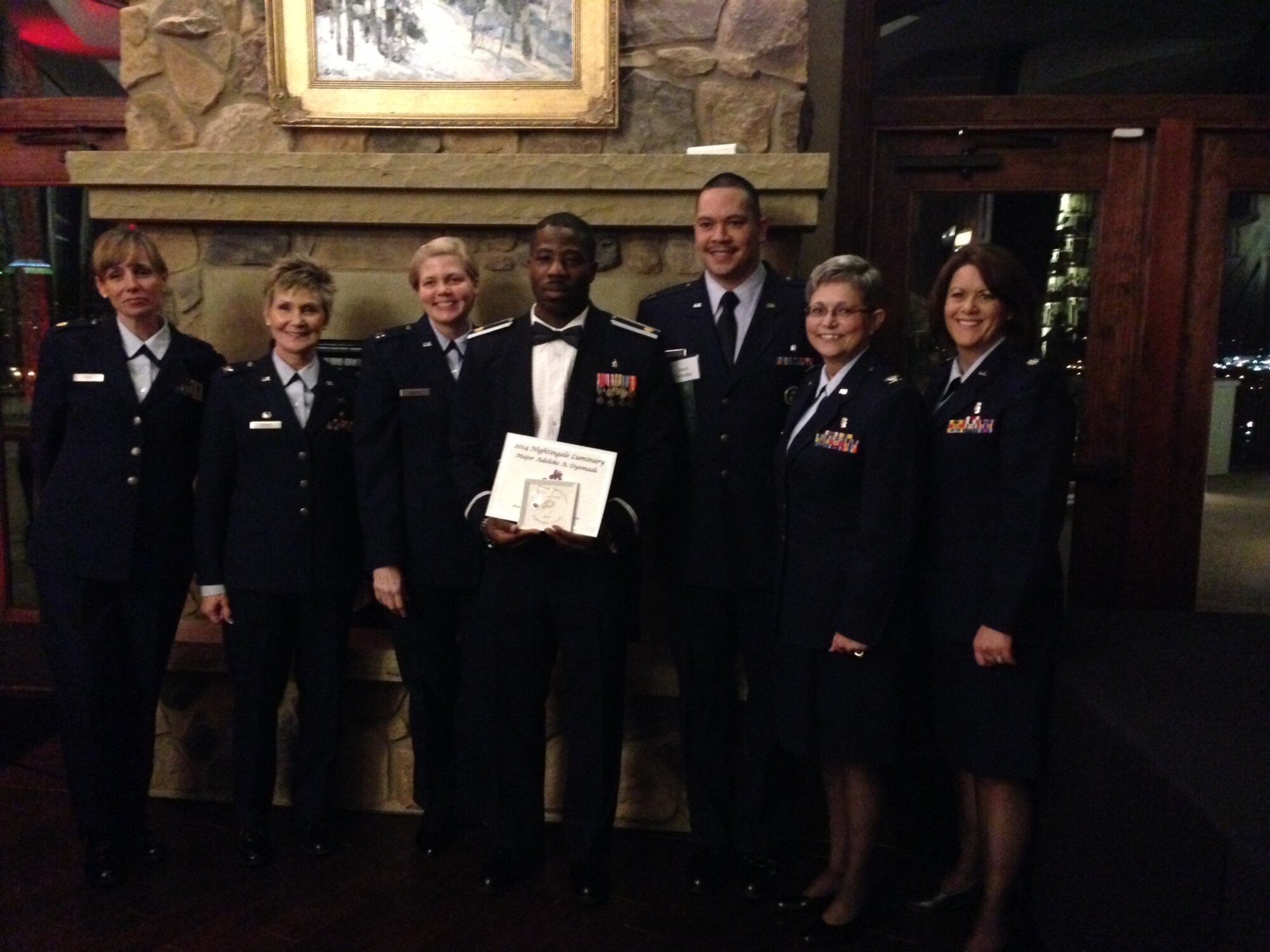 Left to right: Maj. Wendy Cole, Col. Kathleen Craver, Capt.
Sarah Robbins, Maj. Adeleke Oyemade, Capt. Mario Gonzalez, Col. Judy Gavin and
Lt. Col. Lisa Cole pose for a photo during the 2014 Florence Nightingale Award banquet in Colorado Springs March 14. Oyemade won the award for Leadership in Clinical Innovation. (U.S. Air Force/Courtesy Photo) 
