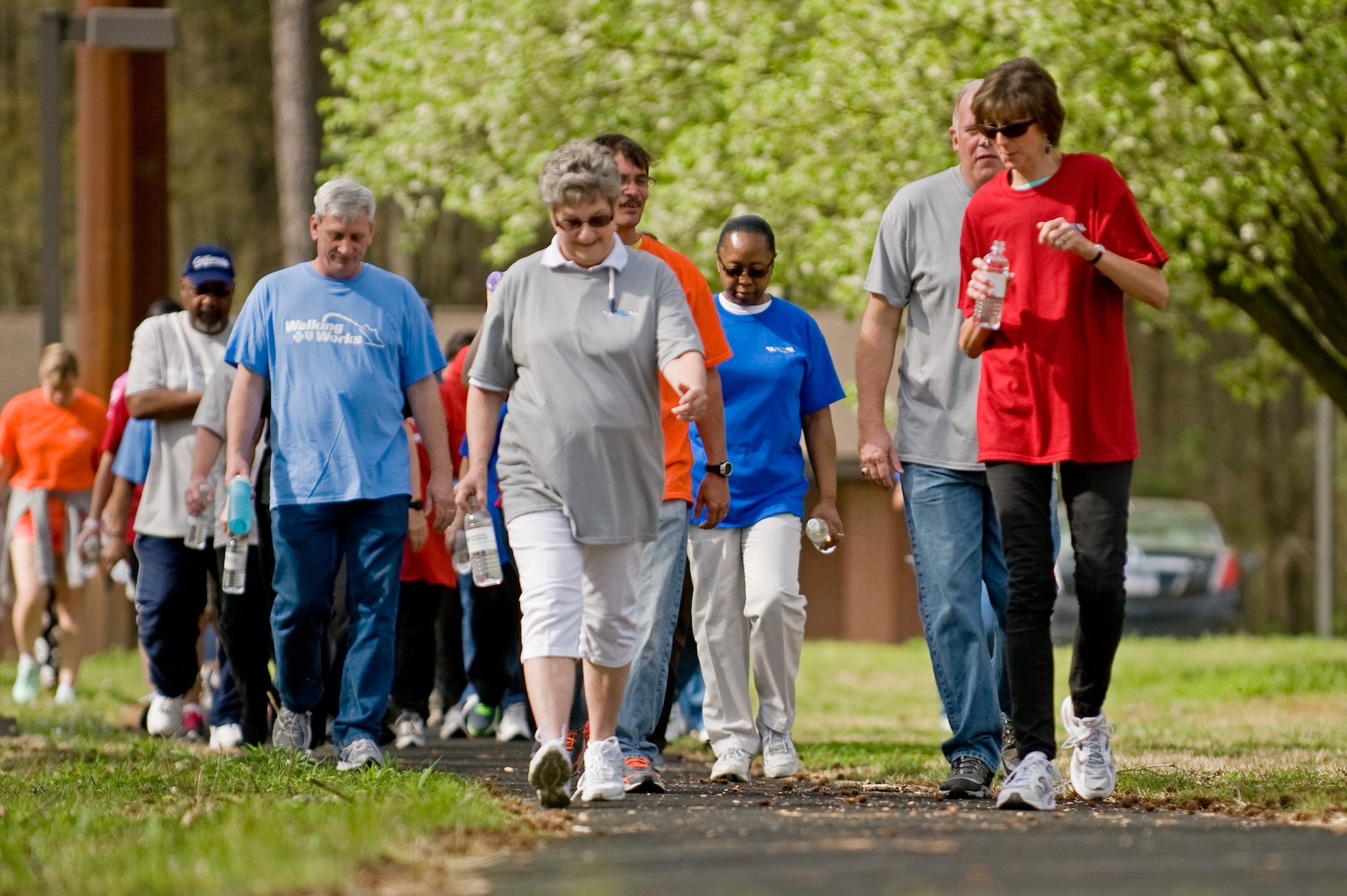 Team Seymour civilians walk one mile April 4, 2014 to celebrate National Walk to Work Day at Seymour Johnson Air Force Base, N.C. The annual event, held on the first Friday of April, was established in 2004 by the U.S. Department of Health and Human Services to promote fitness in the community. (U.S. Air Force photo/Airman 1st Class Aaron J. Jenne)