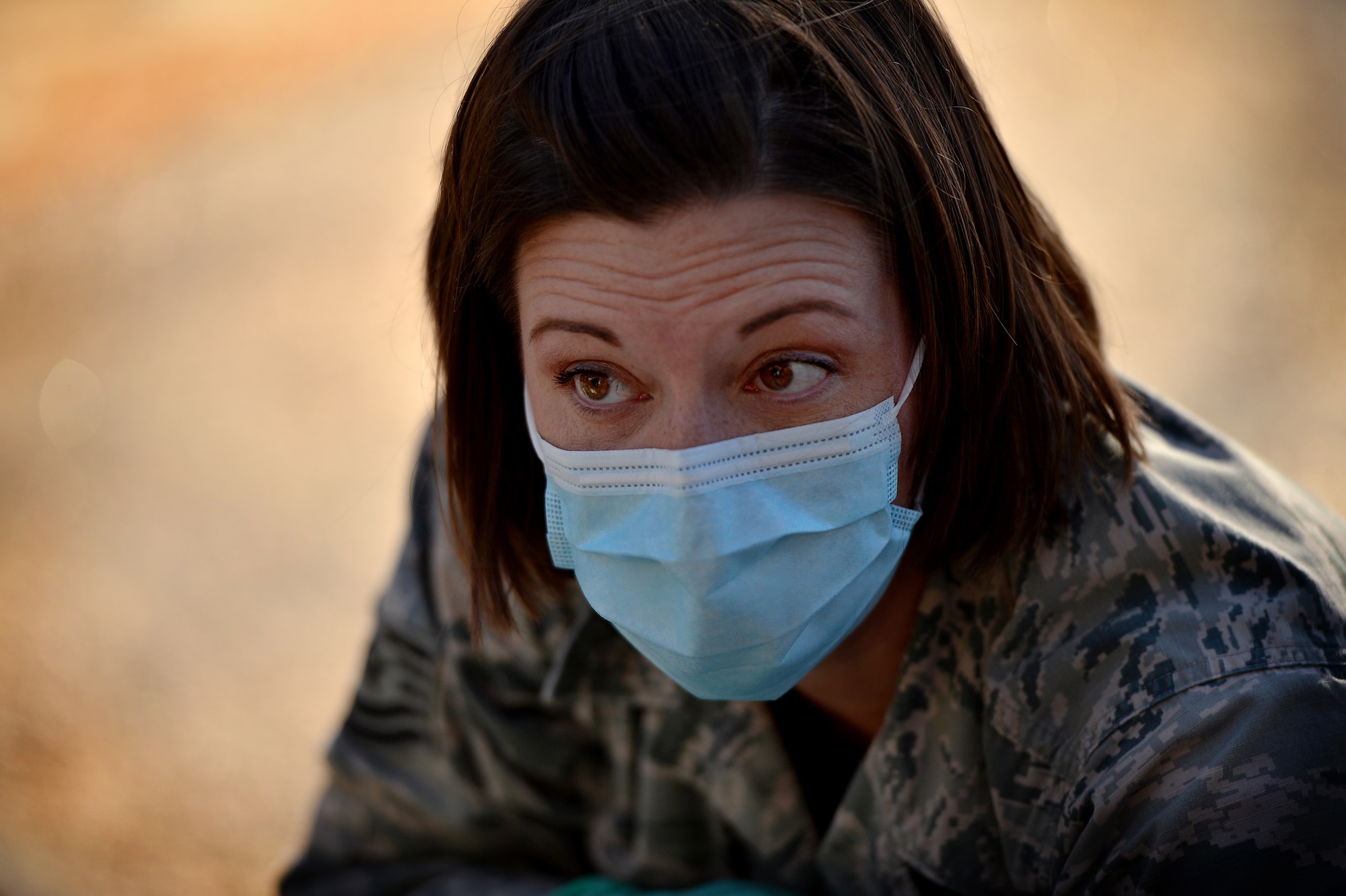 U.S. Air Force Tech Sgt. Jennifer Barlow, 20th Dental Squadron laboratory flight chief communicates with patients affected by a simulated chemical and biological attack during a Mass Accident Response Exercise, April 4, 2014, Shaw Air Force Base, S.C. The 20th Medical Group conducted the exercise putting the entire group on high alert to test their ability to handle casualties. (U.S. Air Force photo by Staff Sgt. Kenny Holston/Released)