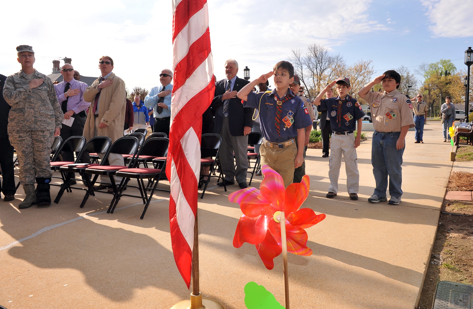 Cub scouts from Pack 422 Den 10 Webelos lead the Pledge of Allegiance before the start of the Pinwheels for Prevention Ceremony held March 31 in front of Warner Robins City Hall. (U.S. Air Force photo by Tommie Horton)