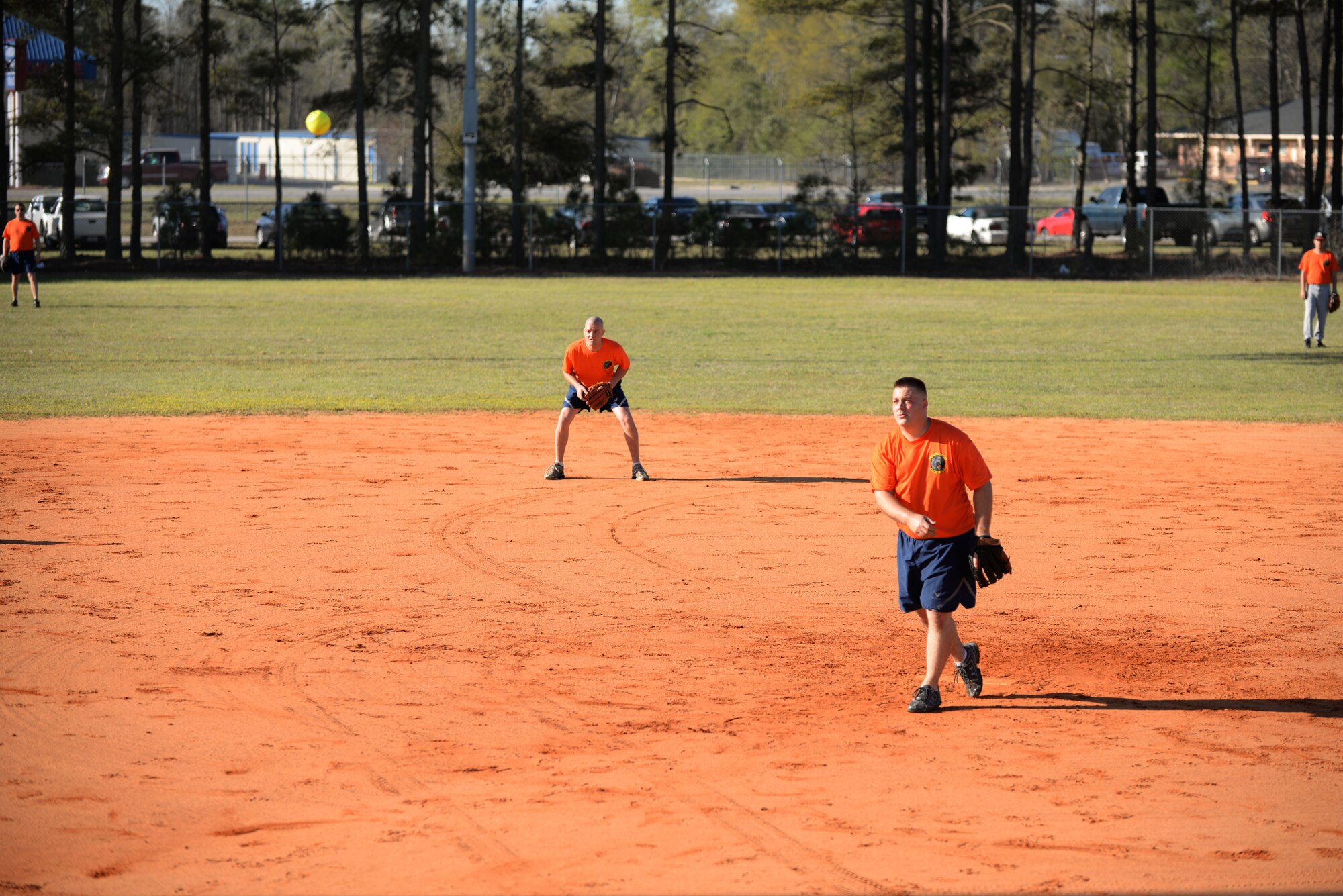 Airmen on the 20th Logistics Readiness Squadron softball team watches for the hit at Shaw Air Force Base, S.C., April 4, 2014. The 20th Mission Support Group held a day of team building events to help boost morale of Airmen. (U.S. Air Force photo by Airmen 1st Class Michael A. Cossaboom/Released)