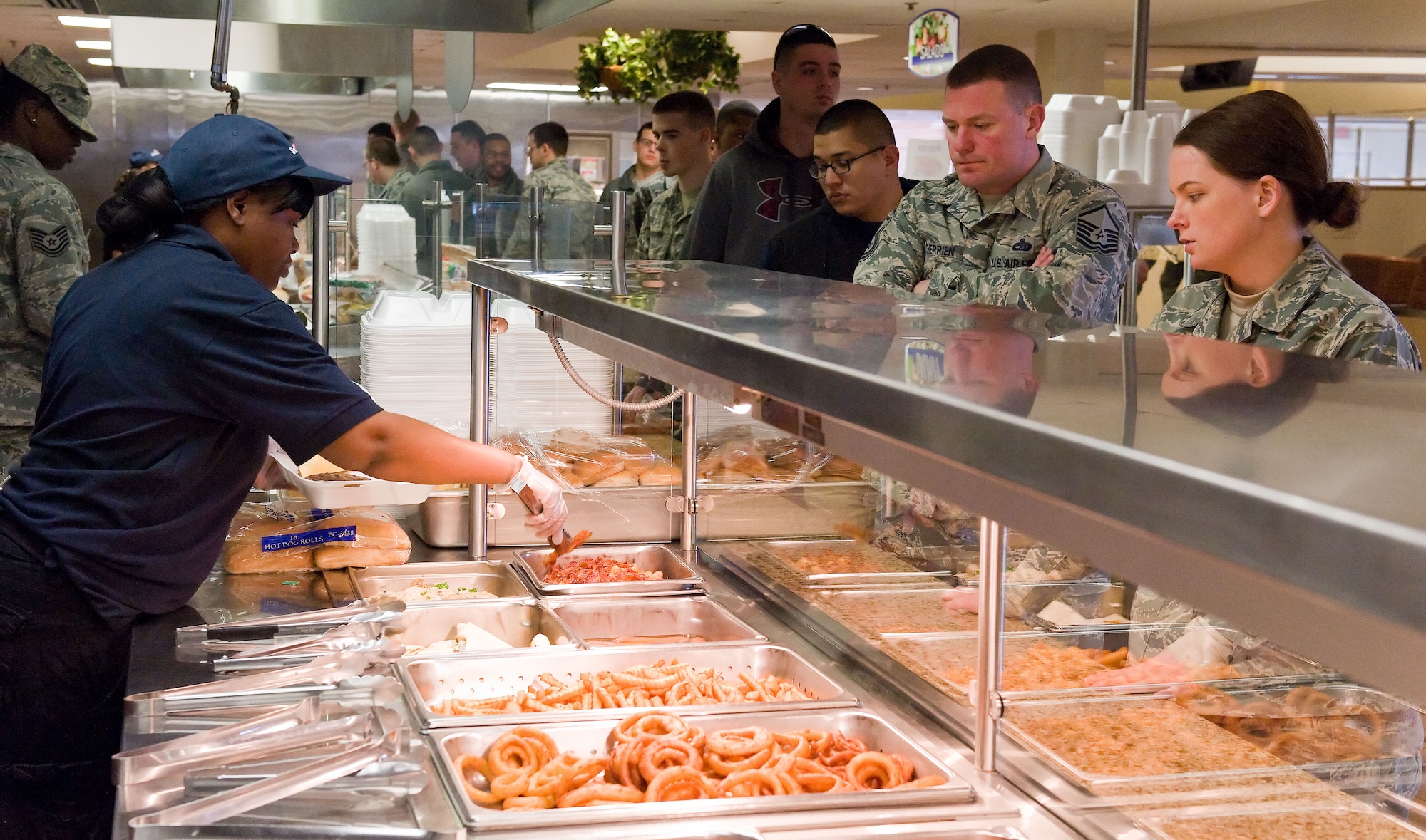 Team Dover members go through the fast food service line March 28, 2014, at the Patterson Dining Facility on Dover Air Force Base, Del. In 2013, 436th Force Support Squadron food service personnel served over 232,000 meals to Patterson Dining Facility patrons. (U.S. Air Force photo/Roland Balik)