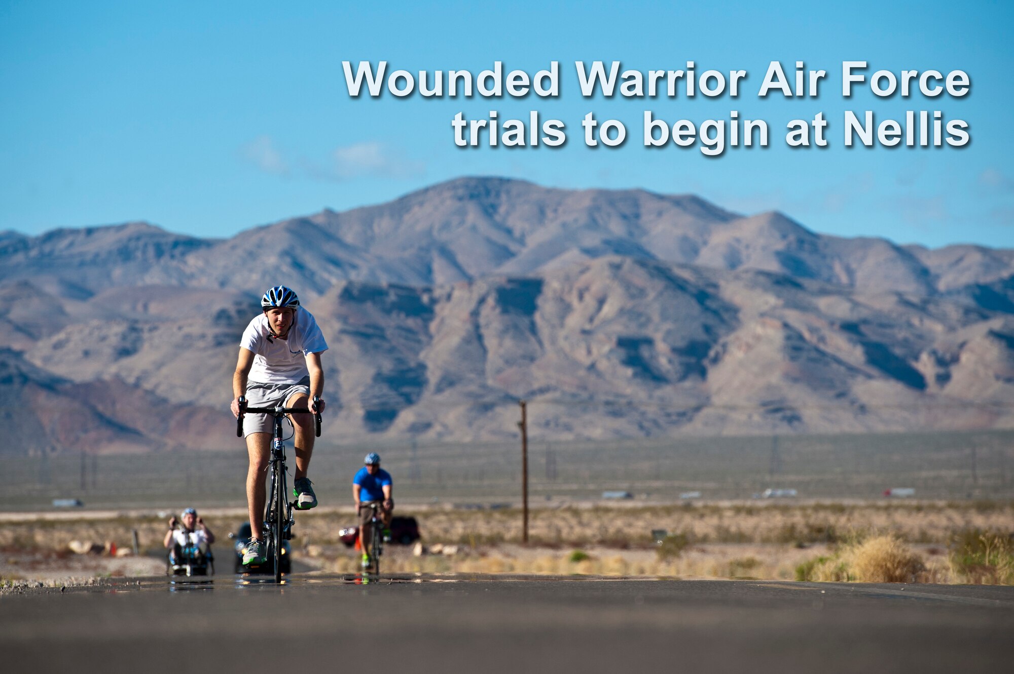Cody Caraker, adaptive sports camp participant, cycles through Nellis Air Force Base, Nev. Area 2 during an Air Force Wounded Warrior Adaptive Sports Camp Feb. 26, 2014. The 2014 Warrior Games Selection Camp will begin April 7 with 100 athletes coming from across the United States to compete for the 40 positions on the U.S. Air Force team. (U.S. Air Force photo by Senior Airman Christopher Tam)