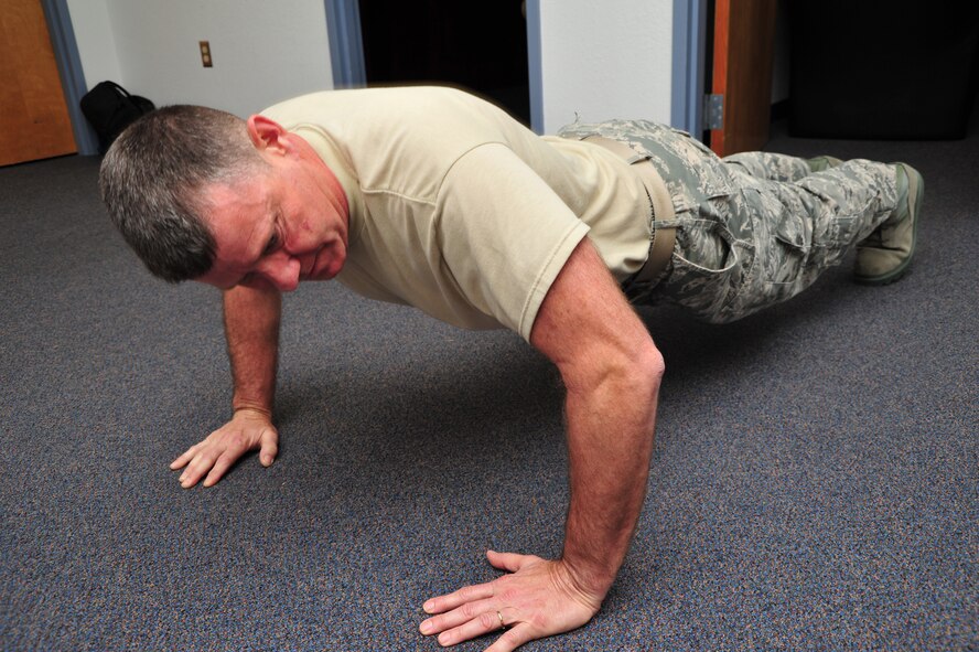 Master Sgt. Paul Martin, 403rd Wing Inspector General Office, takes part in the 403rd Wing Human Resources Development Council push-up contest March 8. He did 81 push ups. (U.S. Air Force photo/Tech. Sgt. Ryan Labadens)