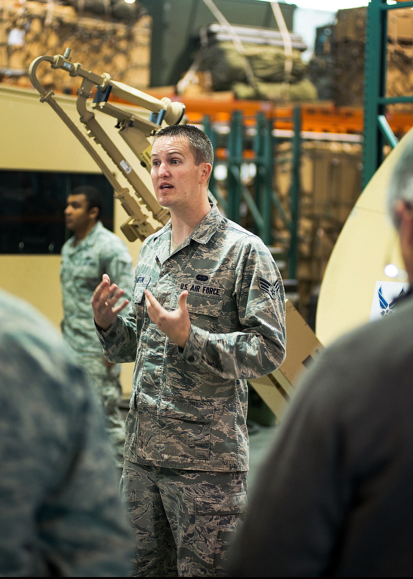 Senior Airman Dereck Hampton, 573rd Global Mobility Squadron cybertransmission systems journeyman, briefs a civic leaders group from Joint Base Lewis-McChord, Wash., on the capabilities of a small package initial communications element system. (U.S. Air Force photo by T.C. Perkins Jr.)
