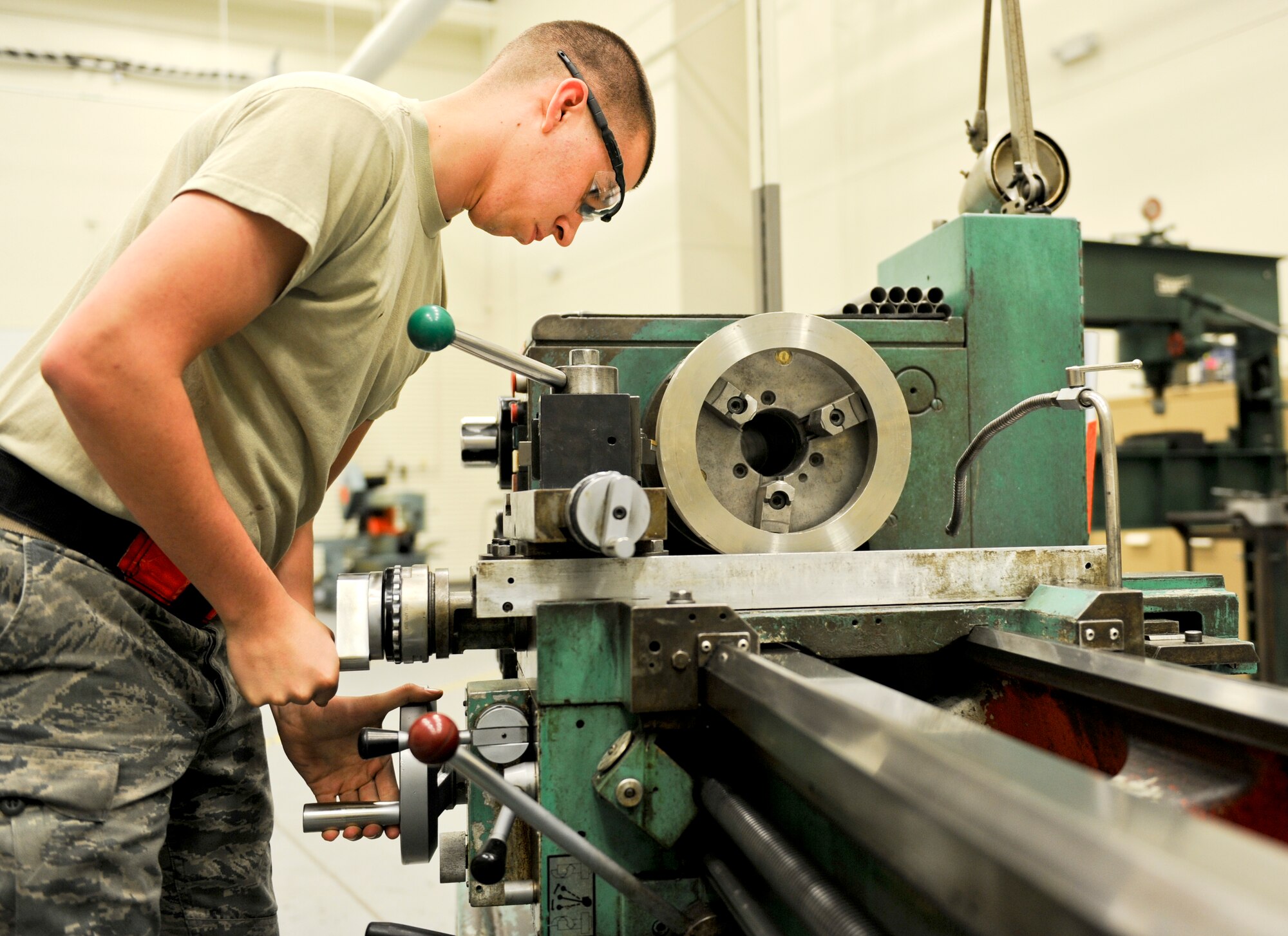 Senior Airman Colton Fogler, 22nd Maintenance Squadron aircraft metals technology journeyman, works on a boom azimuth pulley for the KC-135 Stratotanker, April 1, 2014, at McConnell Air Force Base, Kan.  Fogler manufactures the pulley to save the Air Force more than $9,000 per part instead of having it constructed by an outside contractor. (U.S. Air Force photo/Airman 1st Class David Bernal Del Agua) 