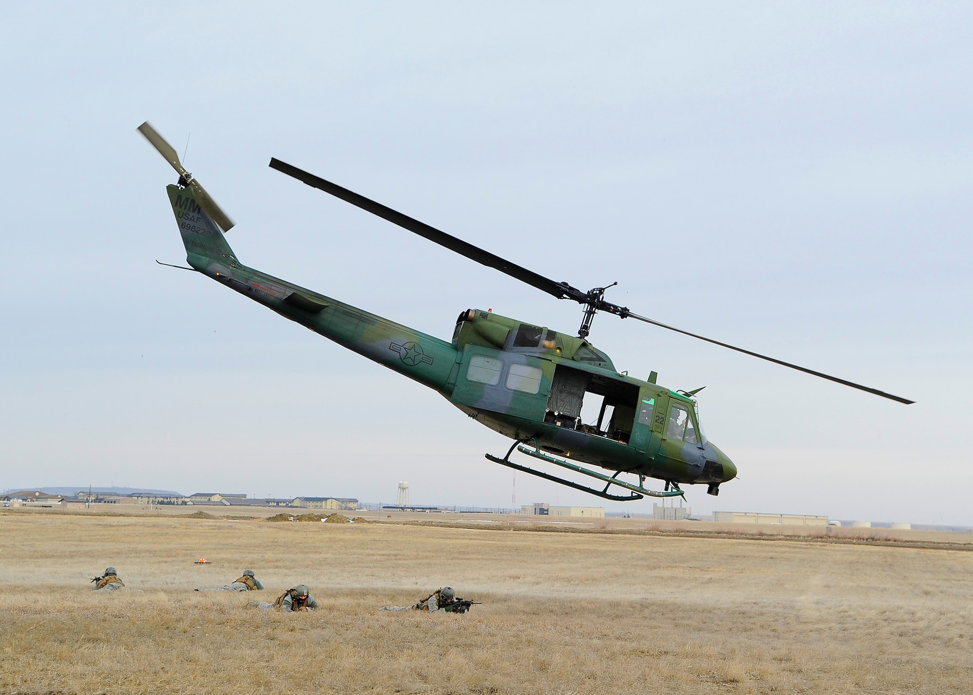 Members from the 341st Security Forces Group Tactical Response Force practice an exfiltration maneuver during a training session at the Warrior Launch Facility trainer March 25. In all, 28 Team Malmstrom members participated in the training session. (U.S. Air Force photo/Airman 1st Class Collin Schmidt)