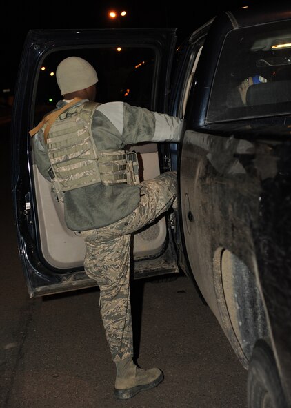 Airman 1st Class Danallen Lee, 341st Security Forces Squadron member, gets in a security forces vehicle after loading equipment into the back March 25. Lee will start a typical day at 5 a.m. and, although normally works an eight-hour shift, could work for upwards of 12 hours. (U.S. Air Force photo/Senior Airman Cortney Paxton) 