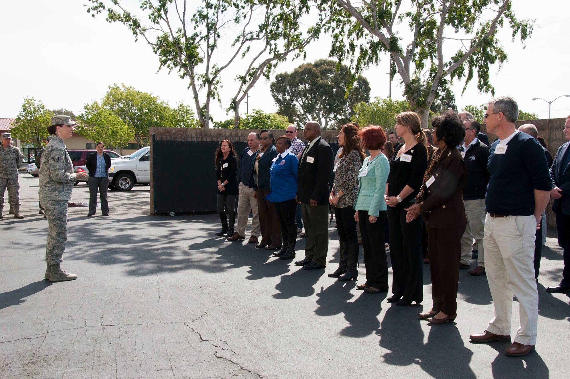 TRAVIS AIR FORCE BASE, Calif. -- Staff Sgt. Lauren Coulter, Airman Leadership School instructor, teaches basic drill movements to honorary commanders, April 3, 2014. (U.S. Air Force photo/Staff Sgt. Cindy G. Alejandrez)