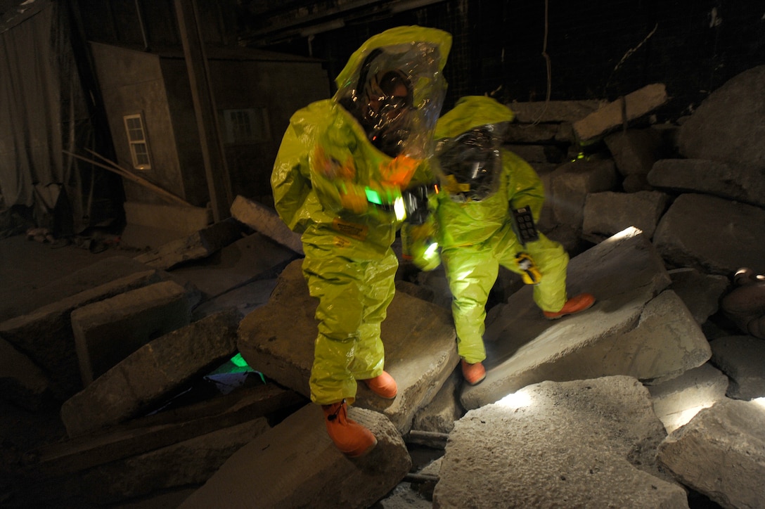 Airmen use their equipment to detect live chemical agents during a hazardous environment training exercise at the Center for National Response in W.Va., March 27, 2014. Teams of bioenvironmental engineers, emergency management specialists and firefighters went through various scenarios throughout Black Flag, a two-week training course to detect trace chemical and biological agents. (U.S. Air Force Photo/ Airman 1st Class Nesha Humes)