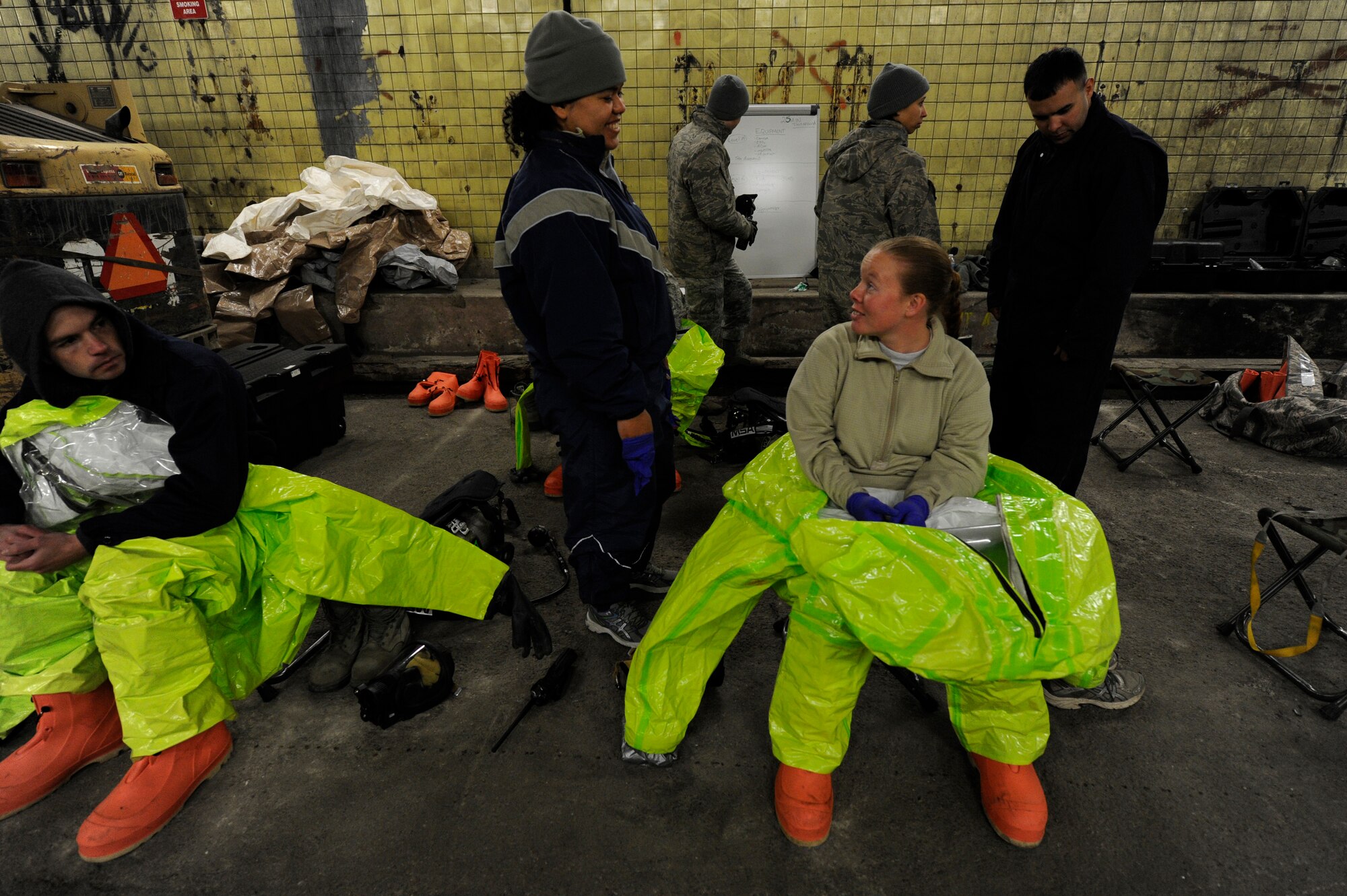 Airmen prepare to change into hazardous material suits during Black Flag, a training exercise at the Center for National Response in W.Va., March 27, 2014. More than forty active duty, guard and reserve Airmen learn real-world emergency response training during the two-week exercise. (U.S. Air Force Photo/ Airman 1st Class Nesha Humes)