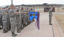 Airmen from the 28th Maintenance Squadron salute the flag during a retreat ceremony at Ellsworth Air Force Base, S.D., March 27, 2014. Each month, one squadron on base performs a retreat ceremony at the base flagpole as a way of remembering and honoring the Air Force heritage. (U.S. Air Force photo by Airman 1st Class Rebecca Imwalle/released)