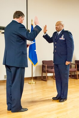 Kentucky’s adjutant general, Maj. Gen. Edward Tonini (left), executes the Oath of Office during a ceremony promoting Charles Walker to the rank of colonel at the Kentucky Air National Guard Base in Louisville, Ky., March 22, 2014. Walker, staff judge advocate for Joint Forces Headquarters Air Component, Kentucky National Guard, is the first African-American to be promoted to the rank of colonel in Kentucky Air Guard history. (U.S. Air National Guard photos by Staff Sgt. Vicky Spesard)