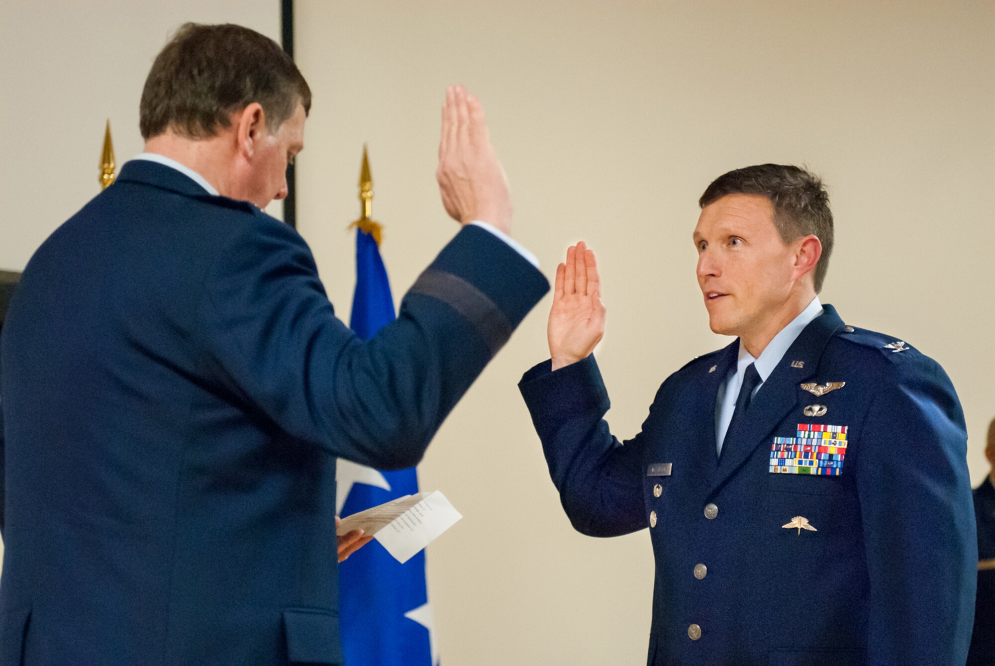 Kentucky’s adjutant general, Maj. Gen. Edward Tonini (left), executes the Oath of Office during a ceremony promoting Jeffrey Wilkinson to the rank of colonel at the Kentucky Air National Guard Base in Louisville, Ky., March 22, 2014. Wilkinson, vice commander of the 123rd Airlift Wing, is the first special tactics officer to be promoted to the rank of colonel in Kentucky Air Guard history. (U.S. Air National Guard photos by Staff Sgt. Vicky Spesard)
