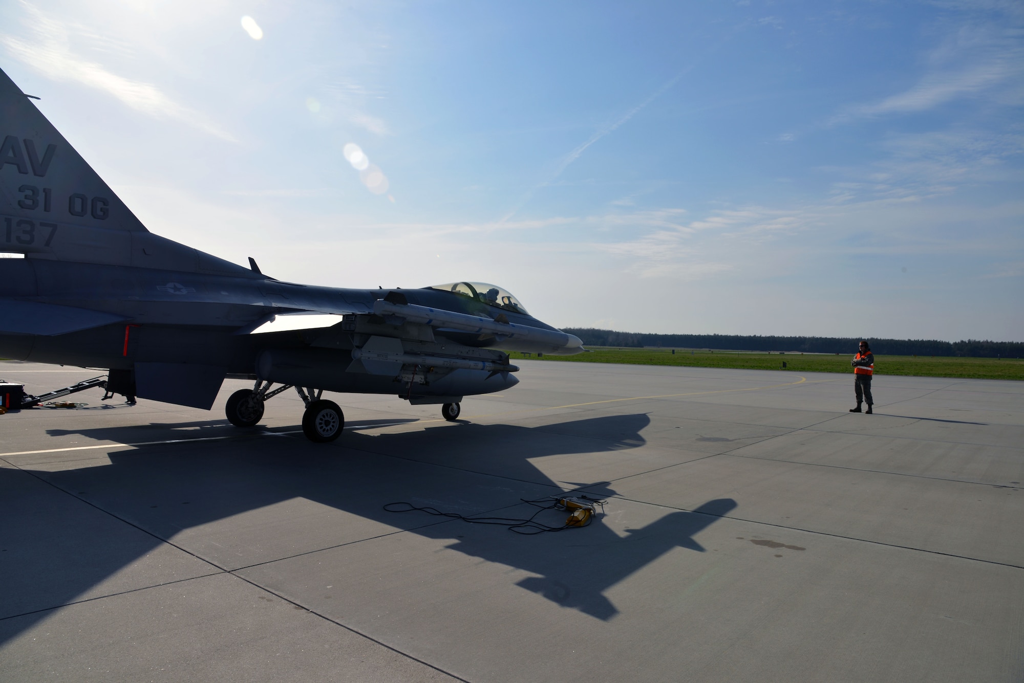 A U.S. F-16 Fighting Falcon fighter aircraft pilot from the 555th Fighter Squadron, Aviano Air Base, Italy, prepares to fly with Polish counterparts at Lask Air Base, Poland, April 2, 2014. More than 220 U.S. personnel have been training and building partnership capacity with the Polish armed forces since March 13. (U.S. Air Force photo/2nd Lt. Katrina Cheesman/Released) 