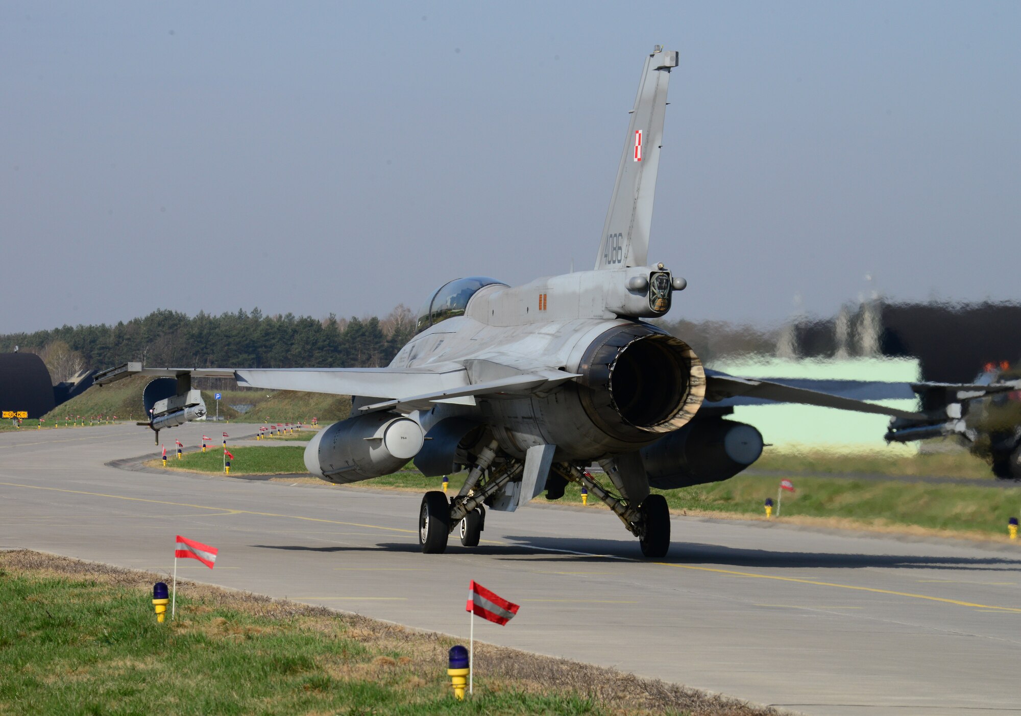 A Polish F-16 Fighting Falcon aircraft taxis toward the flightline for a training mission, April 2, 2014, at Lask Air Base, Poland. Poland continues to build its relationship with the U.S. as both nations' air forces integrated their capabilities through training sorties in a joint theater capacity. (U.S. Air Force photo/Airman 1st Class Ryan Conroy/Released) 