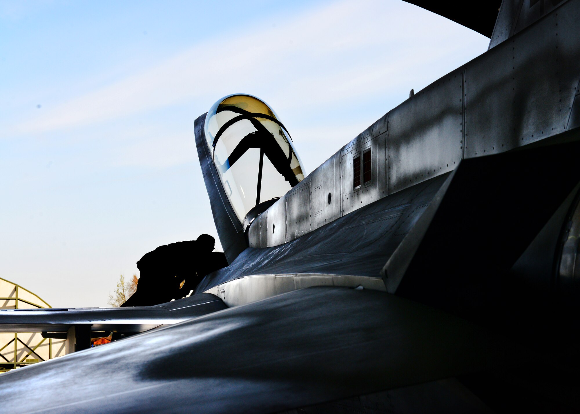 Polish air force Maj. Przemyslaw Struj, 10th Fighter Squadron pilot, climbs into the cockpit of an F-16 Fighting Falcon fighter aircraft before a training mission with U.S. pilots, April 2, 2014, at Lask Air Base, Poland. The Polish air force implemented the use of F-16s to their inventory within the last ten years and is currently hosting twelve U.S. F-16s assigned to Aviano Air Base, Italy to train and build partnership capacity with NATO allies. (U.S. Air Force photo/Airman 1st Class Ryan Conroy/Released) 
