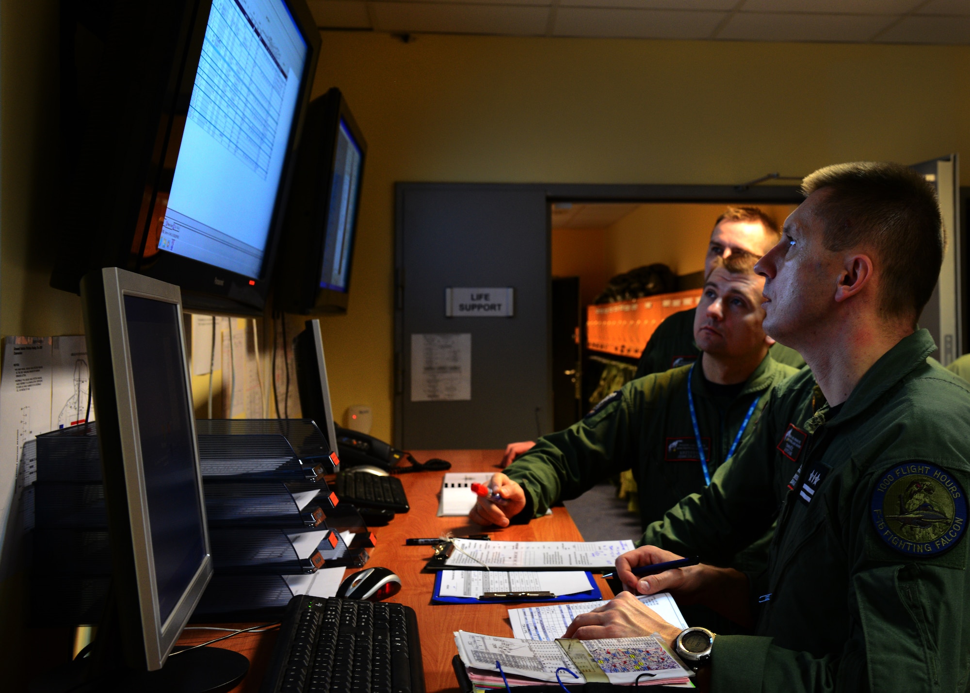 Polish air force pilots go through a pre-flight briefing, April 2, 2014, at Lask Air Base, before flying with U.S pilots. Poland continues to build its relationship with the U.S. as both nations' air forces integrate their capabilities through training sorties in a joint theater capacity. (U.S. Air Force photo/Airman 1st Class Ryan Conroy/Released) 