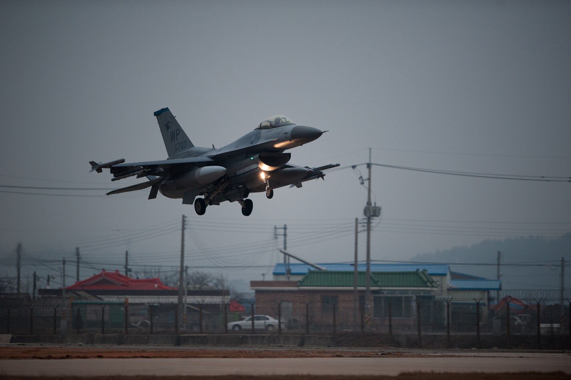 A 35th Fighter Squadron F-16 prepares to land on the Alternate Landing Surface at Kunsan Air Base, Republic of Korea, Mar. 19, 2014. The ALS was activated and utilized to test the Wolf Pack's ability to land aircraft in the event that the primary runway is unavailable. (U.S. Air Force photo by Staff Sgt. Clayton Lenhardt/Released)