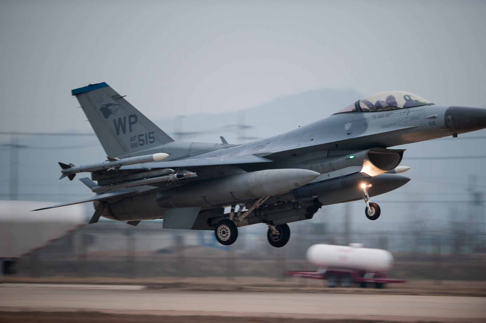 A 35th Fighter Squadron F-16 lands on the Alternate Landing Surface at Kunsan Air Base, Republic of Korea, Mar. 19, 2014. The ALS was activated and utilized to test the Wolf Pack's ability to land aircraft in the event that the primary runway is unavailable. (U.S. Air Force photo by Staff Sgt. Clayton Lenhardt/Released)