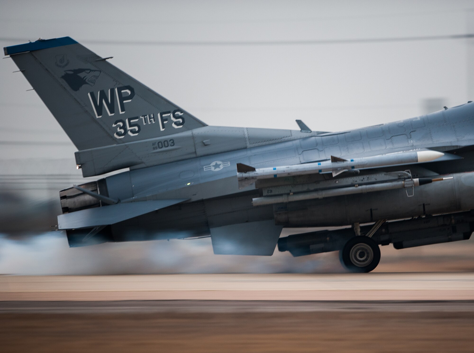A 35th Fighter Squadron F-16 lands on the Alternate Landing Surface at Kunsan Air Base, Republic of Korea, Mar. 19, 2014. The ALS was activated and utilized to test the Wolf Pack's ability to land aircraft in the event that the primary runway is unavailable. (U.S. Air Force photo by Staff Sgt. Clayton Lenhardt/Released)