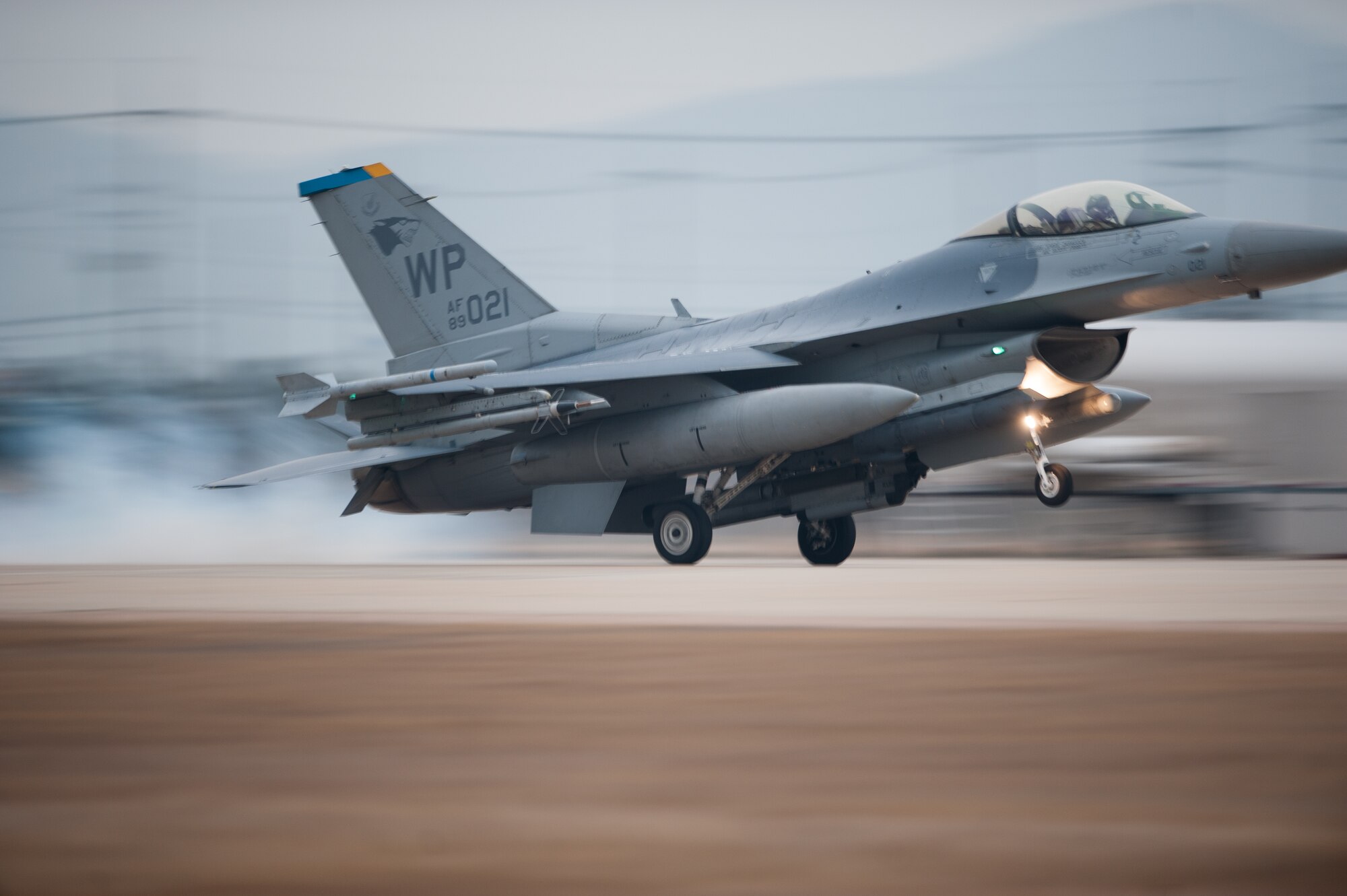Col. S. Clinton Hinote, 8th Fighter Wing commander, lands an F-16 on the Alternate Landing Surface at Kunsan Air Base, Republic of Korea, Mar. 19, 2014. The ALS was activated and utilized to test the Wolf Pack's ability to land aircraft in the event that the primary runway is unavailable. (U.S. Air Force photo by Staff Sgt. Clayton Lenhardt/Released)