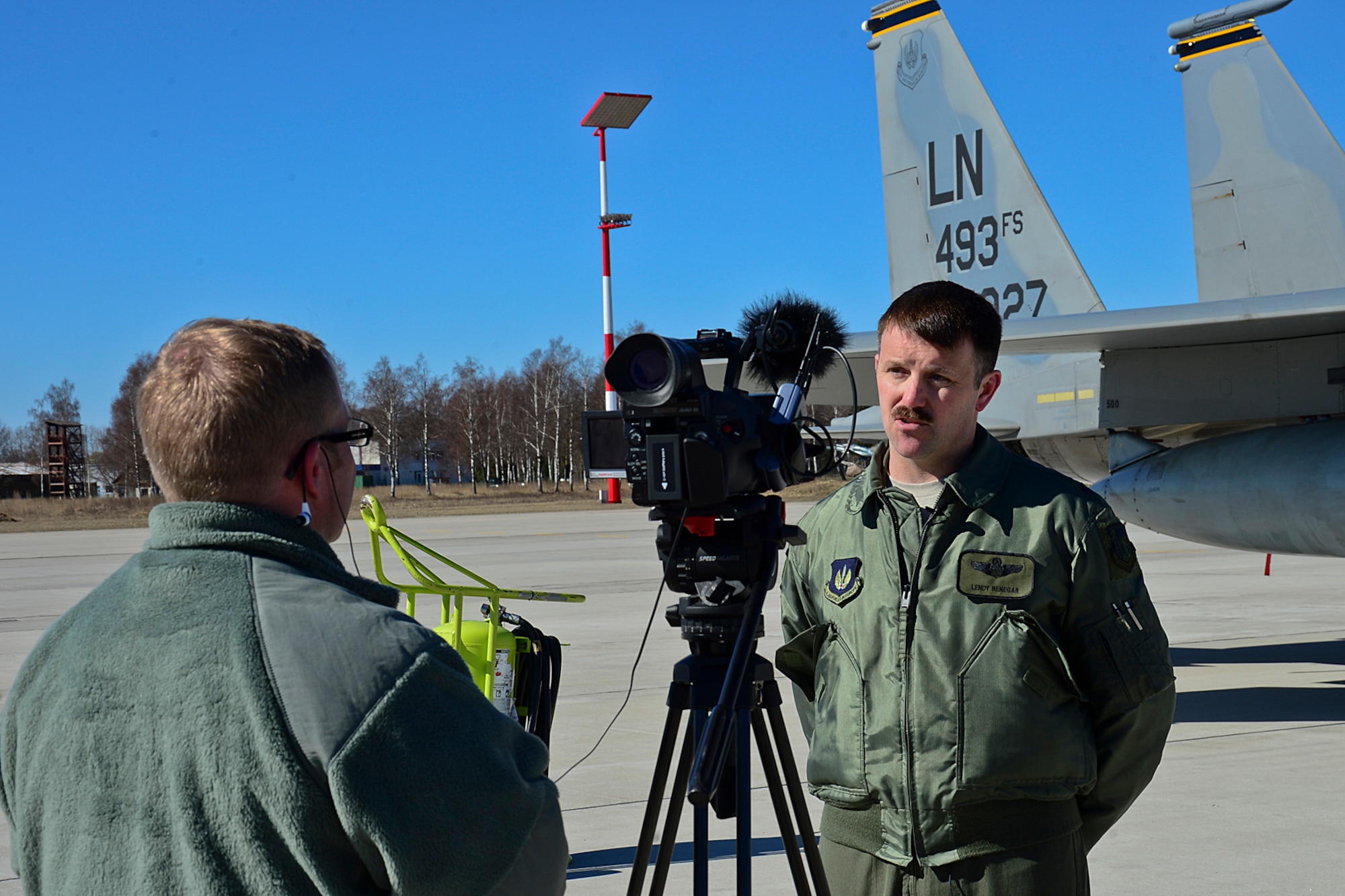 Lieutenant Col. Lendy Renegar, 48th Air Expeditionary Group commander, engages with media during the 17th Baltic Region Training Event at Šiauliai Air Base, Lithuania, April 1, 2014. The event took place in the skies over the Baltic region to sharpen the skills of aircrews and air controllers from the U.S., Lithuanian and Swedish air forces. The event is designed to enhance the interoperability between allied partners in NATO and its Partnership for Peace program. (U.S. Air Force photo by Airman 1st Class Dana J. Butler/Released)