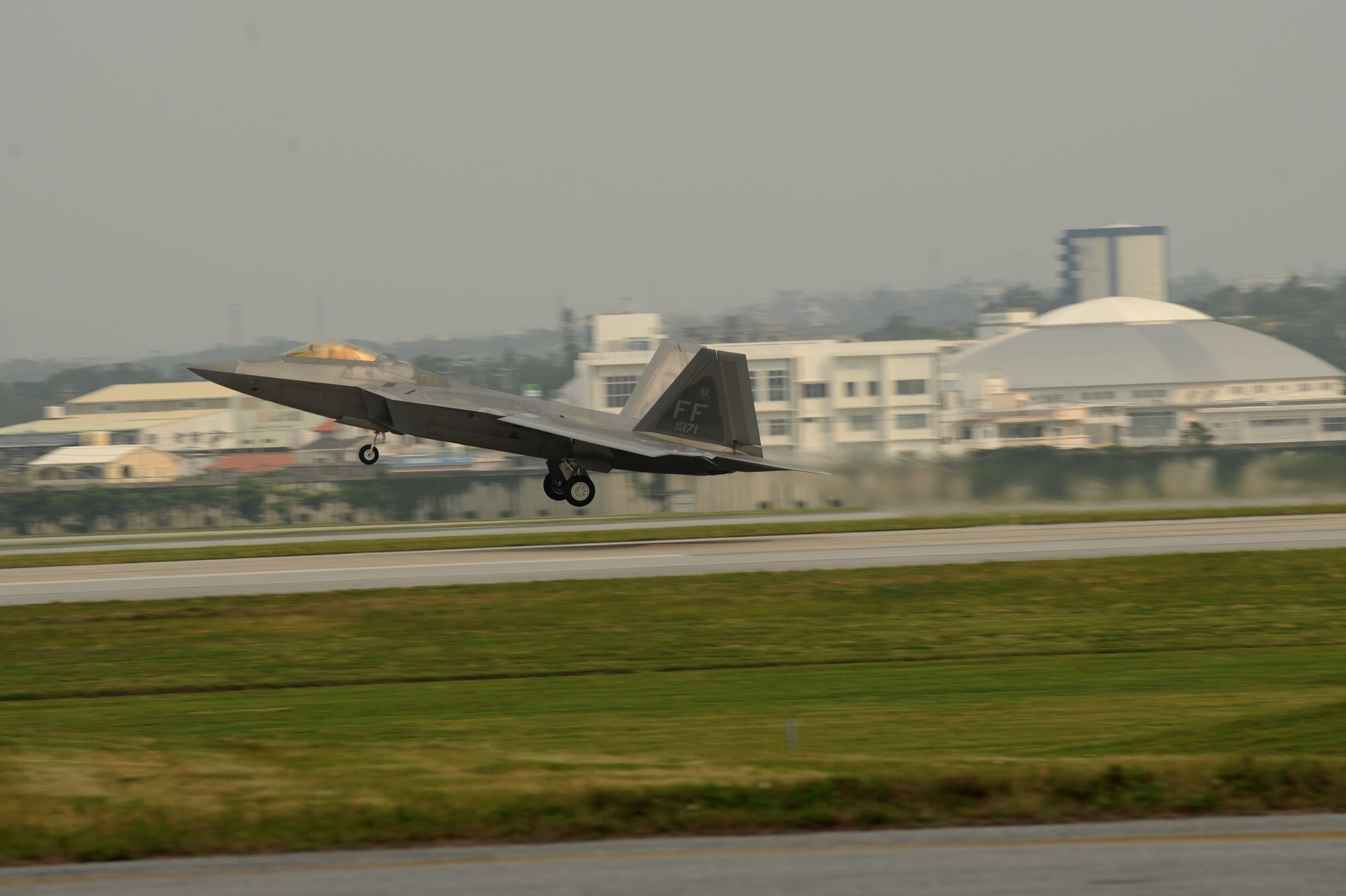 An F-22 Raptor takes off on Kadena Air Base, Japan, April 4, 2014. The 94th Fighter Squadron and the 192nd Fighter Wing participated with the Japan Air Self Defense Force in recurring training recently, strengthening the bilateral partnership with the host nation of Japan. (U.S. Air Force photo by Airman 1st Class Hailey R. Staker)