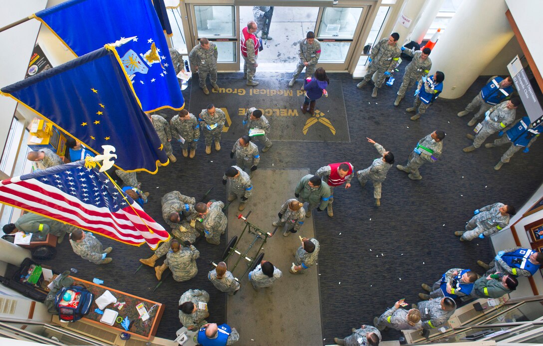 Air Force airmen perform triage and emergency patient care for simulated earthquake casualties during Mission Assurance Exercise 14-3, on Joint Base Elmendorf-Richardson, Alaska, March 27, 2014. The airmen are assigned to the 673d Medical Group.