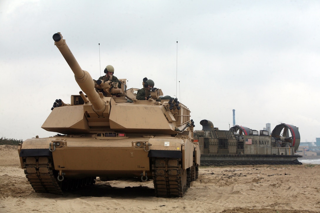 U.S. Marine M1A1 Abrams tank offloads from a U.S. Navy Landing Craft Air Cushion ship for exercise Ssang Yong 2014 in Dogue, Republic of Korea April 3. Ssang Yong, meaning twin dragons, is intended to strengthen ROK-U.S. combat readiness and combined interoperability and advance the ROK Marine Corps Marine Task Force and command and control capabilities through the conduct of combined amphibious operations. The LCAC belongs to Naval Beach Unit 7, and the tank belongs to Company C, 4th Tank Battalion, 4th Marine Division, U.S. Marine Corps Forces Reserve. (U. S. Marine Corps photo by Sgt. Anthony J. Kirby/Released)