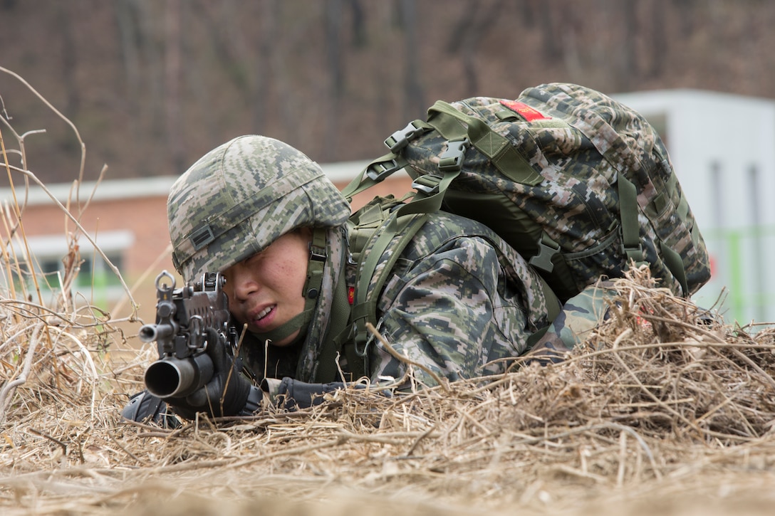 Republic of Korea Marine provides security from the prone position while performing Military Operations on Urban Terrain (MOUT) training, during Exercise Ssang Yong 14 at Ranger Training Site, Pohang, South Korea, April 3, 2014. Exercise Ssang Yong 14 is conducted annually in the Republic of Korea (ROK) to enhance interoperability between U.S. and ROK forces by performing a full spectrum of amphibious operations while showcasing sea-based power projection in the Pacific. (U.S. Marine Corps Photo by Lance Cpl. Tyler S. Dietrich/ Released)