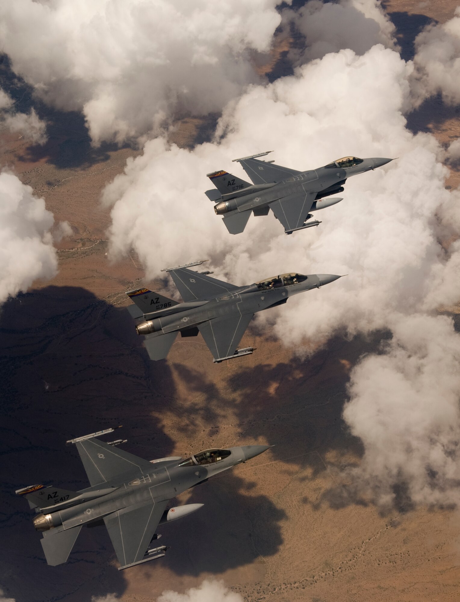 Three Arizona Air National Guard F-16 Fighting Falcons soar over the Arizona desert during a training mission. Guardsmen based at Tucson International Airport carry out a full-time mission to train U.S. and partner-nation fighter pilots. (U.S. Air Force photo/ Master Sgt. Jack Braden)