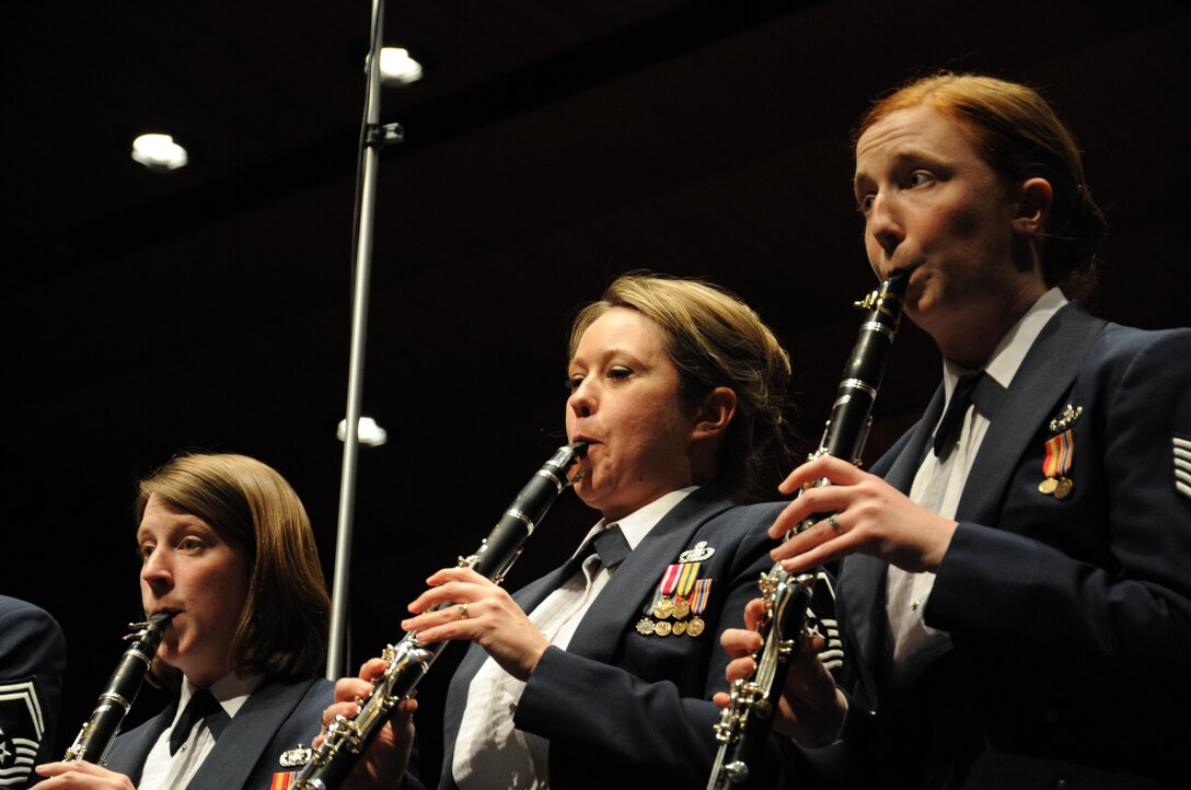 Clarinetists with the U.S. Air Force’s Concert Band perform during a concert featuring the U.S. Air Force Band’s Concert Band and Singing Sergeants at here at the College of DuPage in Glen Ellyn, Ill, April 4, 2014. The Concert Band is the Band’s largest ensemble which performs a wide variety of repertoire from light classics, popular favorites and instrumental features, to classical works. (U.S. Air Force photo/Master Sgt. Tammie Moore)