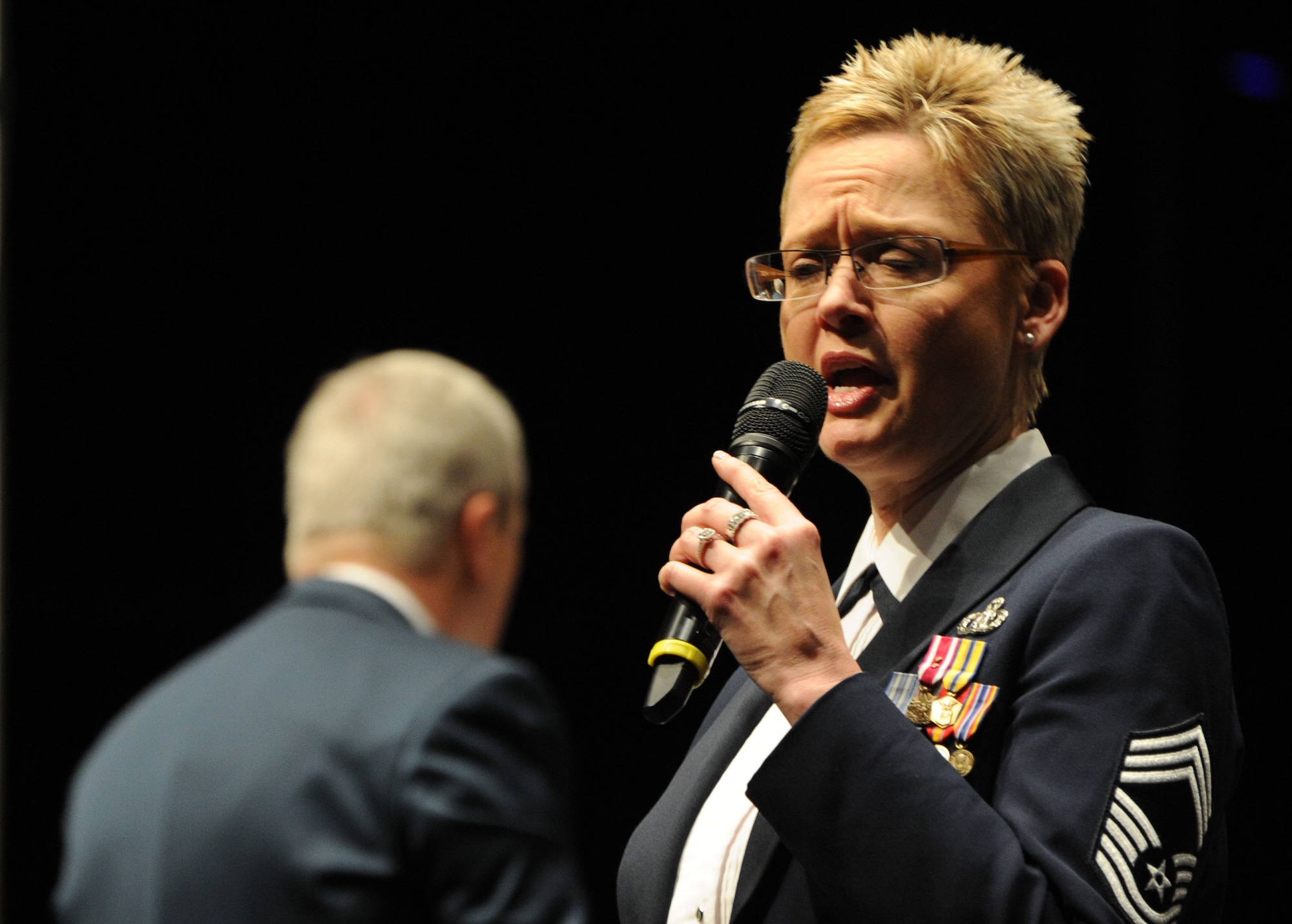Chief Master Sgt. Angela Burns performs during a concert featuring the U.S. Air Force Band’s Concert Band and Singing Sergeants at the College of DuPage in Glen Ellyn, Ill, April 4, 2014. Burns a native of Wilmington, N.C., is an alto vocalist and the flight chief of the Singing Sergeants. She began her Air Force career in 1994. (U.S. Air Force photo/Master Sgt. Tammie Moore)